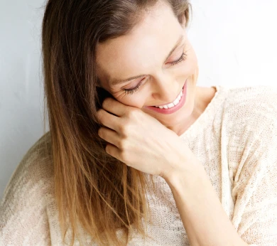 Woman smiling looking down
